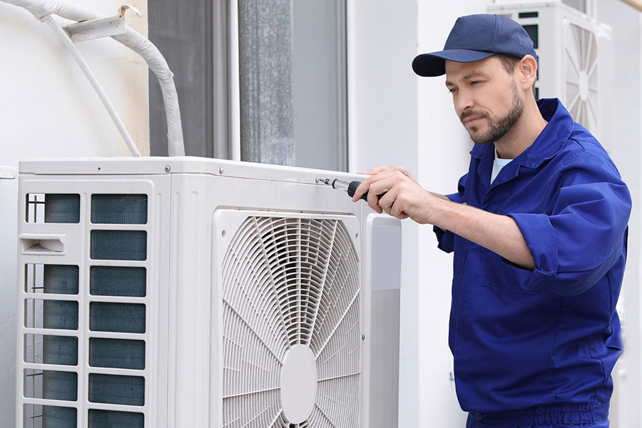 Bakers Technician repairing commercial hvac unit